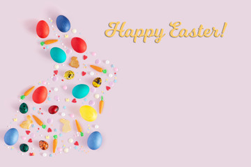 Top view and flat lay of arrangement decoration Happy Easter, holiday background concept. Colorful bunny cookies, eggs and topping ornament design as big rabbit on pink pastel desk with copy space.