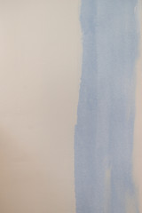 Blue paint swatch on white wall
