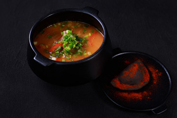 Hungarian goulash soup bograch, meat stew in a cast iron pot. meat restaurant, ethnic cuisine.
