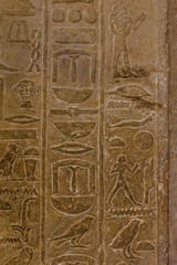 Egyptian ancient hieroglyphs on the stone wall