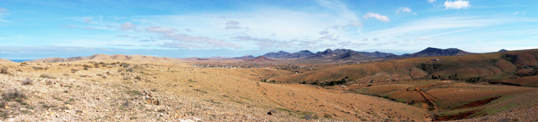 Fototapeta na wymiar Beautiful panorama of volcanic mountains. Fuerteventura. Canary Islands. Spain