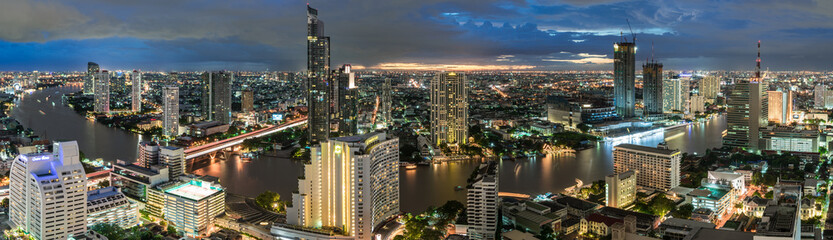 Bangkok city - Beautiful sunset curve Chao Phraya River panoramic Cityscape urban  of Bangkok city at night  , panorama landscape Thailand