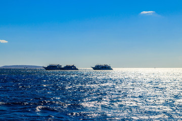 White yachts on the horizon at Red sea