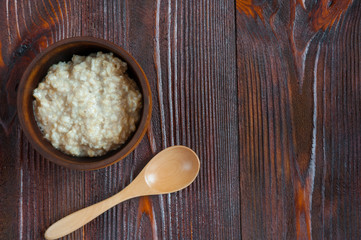 Healthy diet. Tasty oatmeal on wooden table. Top view. Copy space. Rustic.