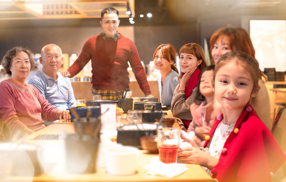 Happy Asian Family Having Dinner And Celebrating Chinese New Year