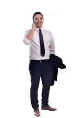 Fototapeta premium Young businessman wearing a black suit with white shirt and black tie, holding his jacket and his phone, posing, isolated on white