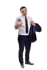 Young businessman wearing a black suit  with white shirt and black tie, holding his jacket and his phone, posing, isolated on white
