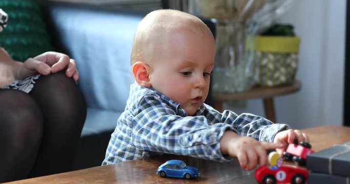 Cute Baby Boy Playing With Toy Cars, Close Up View Portrait - DCi 4K Resolution
