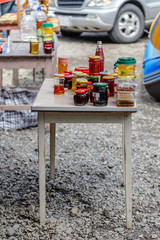 wooden table with jars of jam