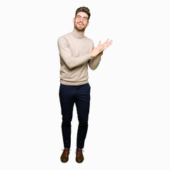 Young handsome business man wearing glasses Clapping and applauding happy and joyful, smiling proud...