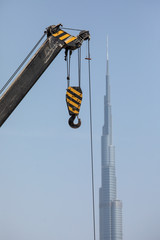 Obraz premium Construction activity in Dubai downtown in Dubai, UAE. Dubai is the most populous city and emirate in the United Arab Emirates