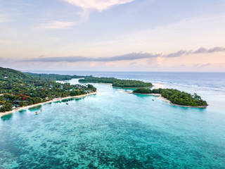 An aerial view of sunrise at Muri Lagoon on Rarotonga in the Cook Islands