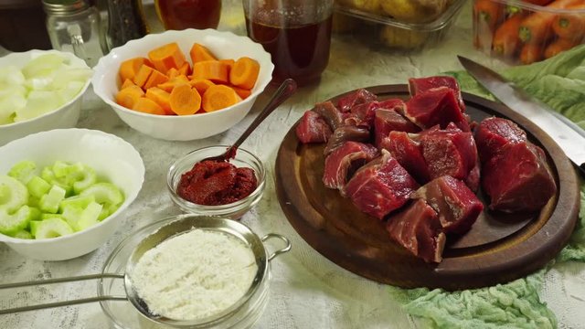 Ingredients for preparing Irish stew: beef, potatoes, carrots and herbs