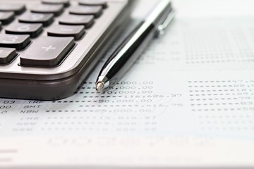 Business, finance, savings money, investment, taxes or accounting concept : Calculator and pen on...