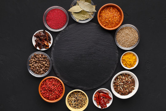 Assorted indian spices in circle with space for text © Prostock-studio