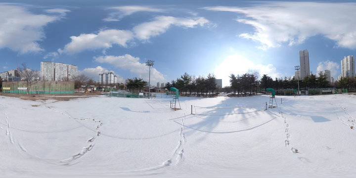 BUCHEON, SOUTH KOREA - December 13, 2018:  Panorama 360 degrees angle view of snow-covered park on a sunny day.
