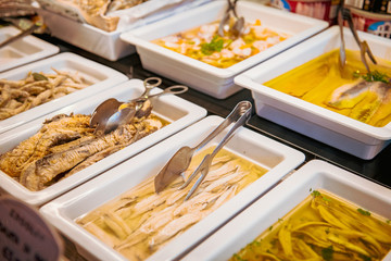 Prepared seafood plates display in del shop