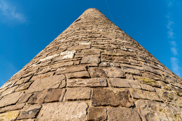 Fototapeta na wymiar pyramid of stones on blue sky background