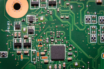 green computer board with chips and pins