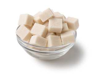 Refined sugar in glass bowl on white background