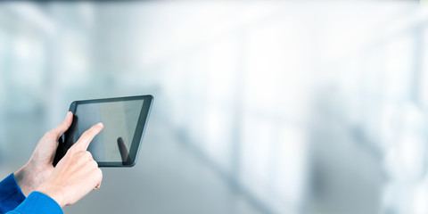 hand-held digital screen or laptop and space