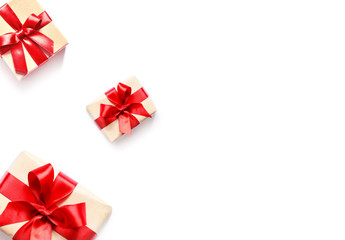 Gift box with red ribbon isolated on white