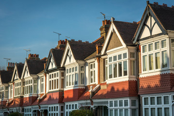 Fototapeta na wymiar Row of typical British homes against a clear blue sky