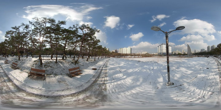 BUCHEON, SOUTH KOREA - December 13, 2018:  Panorama 360 degrees angle view of snow-covered park on a sunny day.