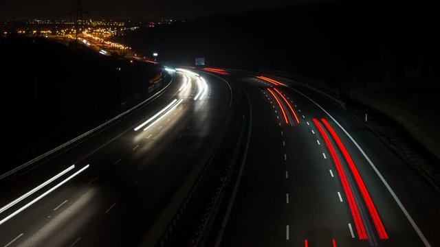 Timelapse highway traffic in the night, car light trails A4 motorway, Poland