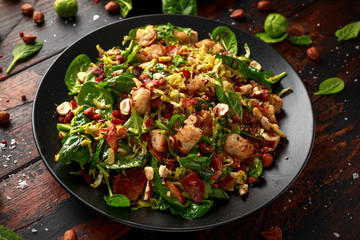 Roasted brussel sprouts, bacon warm salad with spinach, croutons and hazelnuts