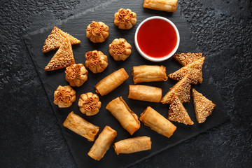 Crispy Chicken wontons, vegetable spring rolls and prawn toasts with sweet chilli sauce. chinese...