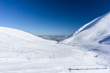 Fototapeta na wymiar Winter landscape of an empty snow covered ski resort in the mountains.