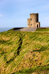 Fototapeta na wymiar Castle tower over Cliffs of Moher