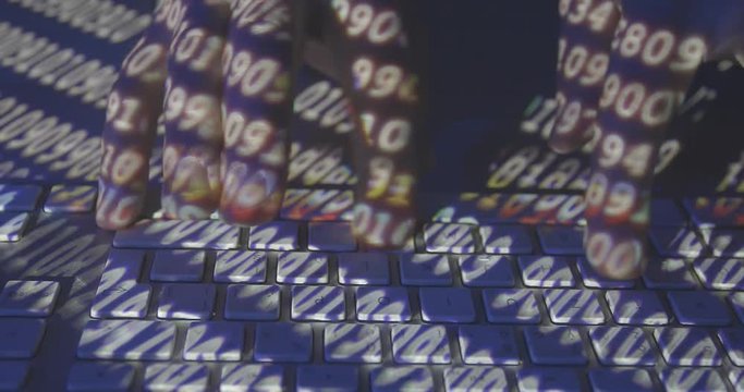 Hands of hacker writes code on the keyboard