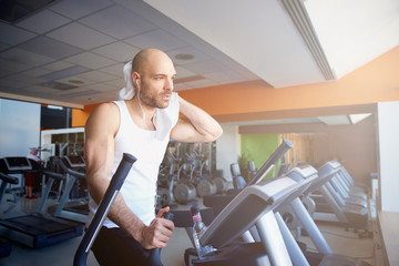 Fototapeta premium Man doing cardio training on treadmill