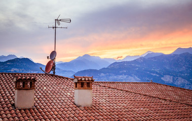 TV Antenna on the roof of an Italian house, Sunset
