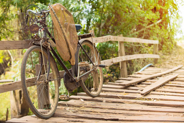 Bicycle on the bridge made of old wood in the countryside