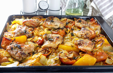 Delicious fried chicken with fresh vegetables, fruits and spices