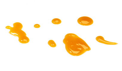 Puddle of  orange sweet and sour sauce  isolated on white background,