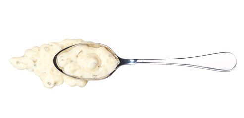Tartar sauce in small metal spoon  isolated on white background,top view