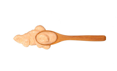 Shrimp sauce    in small wooden spoon isolated on white background,top view