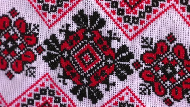 Antique towel in red and black colors. Traditional red and black cross-stitch. Belarusian folk embroidery, three colors - white, red and black