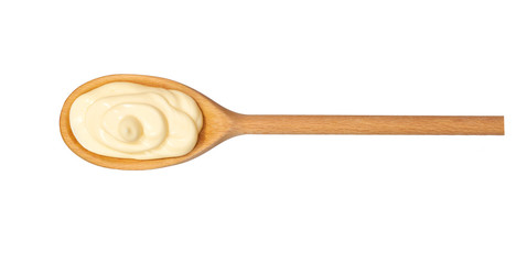 Mayonnaise sauce in wooden spoon isolated on white background,top view