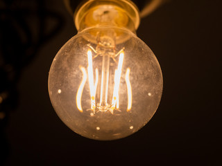 Light bulb Edison close-up. Diode lamps in the loft style room. The light in the dust