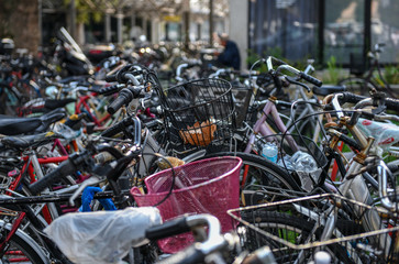 Bunch of bikes or bicycles parked in a street in Italy