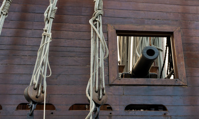 Old wooden Ship gun sailing ship ropes