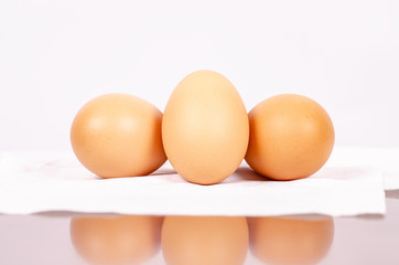 Three eggs isolated on white background