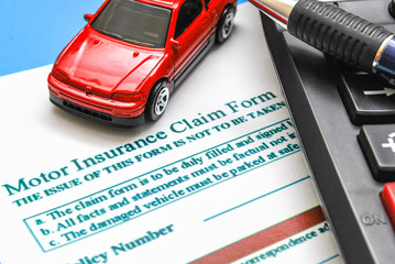 Car insurance claim form on desk