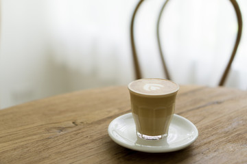 cup of coffee on wooden table, cafe latte milk coffee