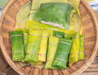food wrapped in banana leaves and grilled.